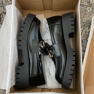 Black platform loafers
